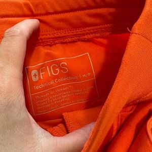 Figs Scrubs in Orange.